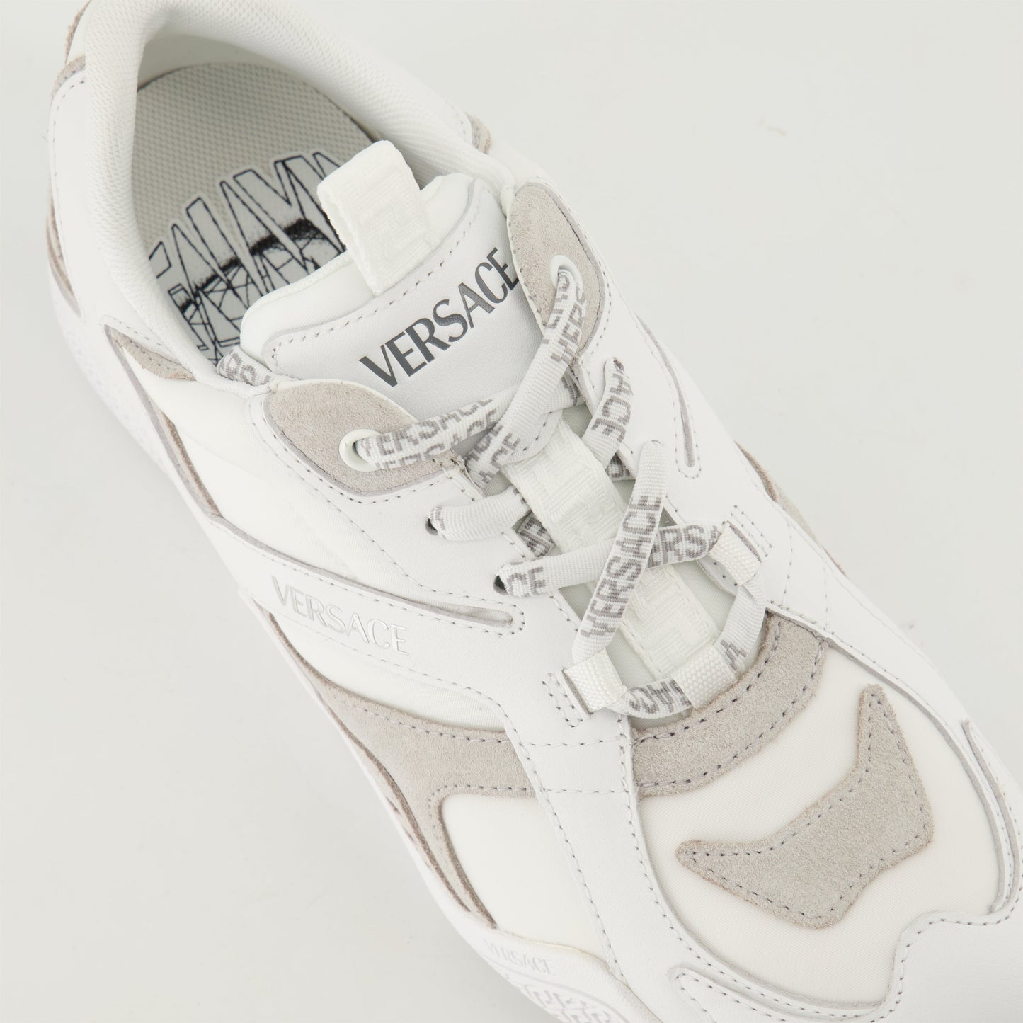 white leather sneakers, Versace sneakers, luxury casual shoes, Spring-Summer 2025, elegant footwear