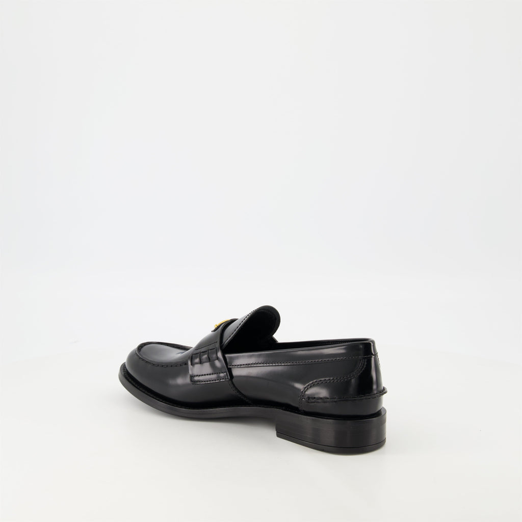 black leather moccasins, Prada footwear, brushed leather shoes, designer slip-ons, stylish moccasins