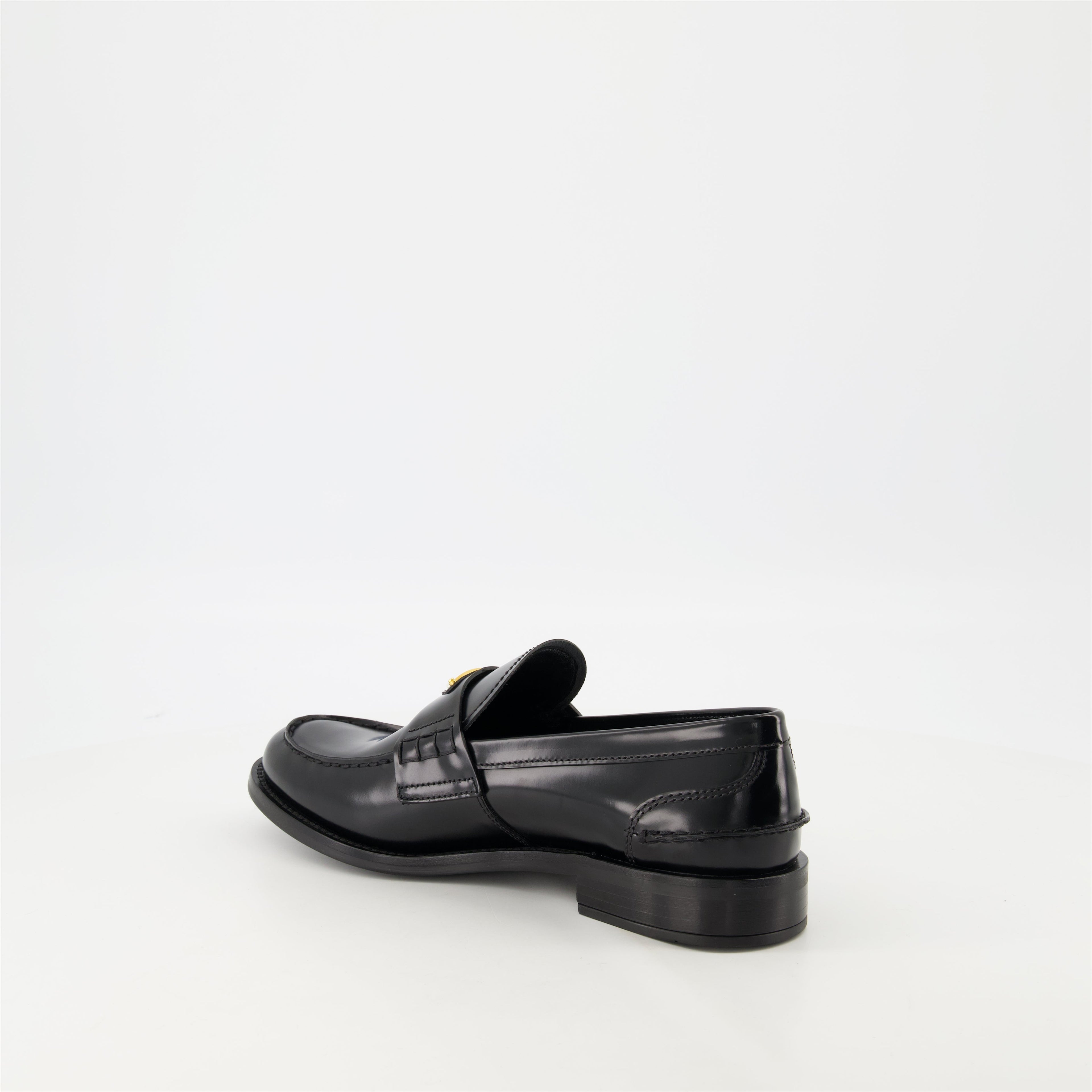 black leather moccasins, Prada footwear, brushed leather shoes, designer slip-ons, stylish moccasins