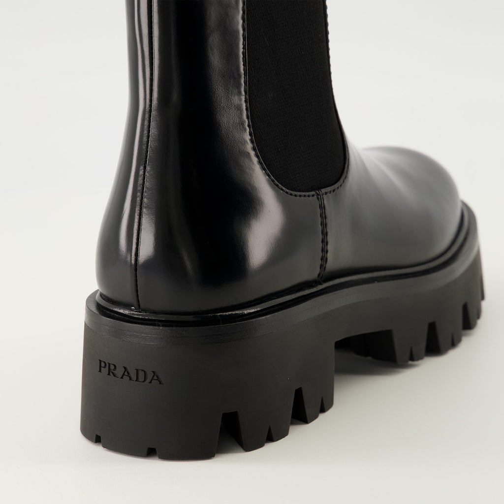 Prada ankle boots, black leather boots, Autumn-Winter 2025, slip-on design, rubber tread sole