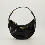 Image of Black Patent Leather Arque Bag by Prada for Women - Season Spring-Summer 2025 - Front View