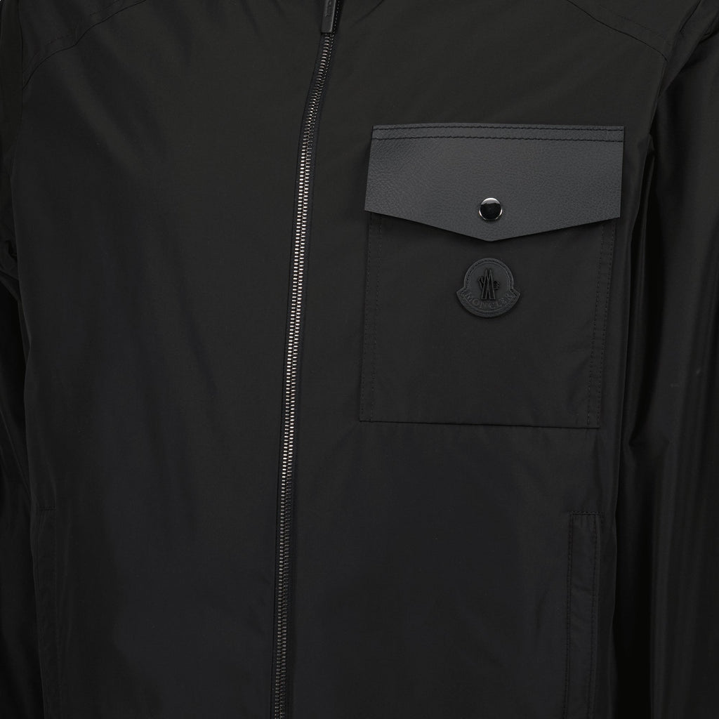 black windbreaker, adjustable hood, leather details, autumn-winter jacket, ribbed edges