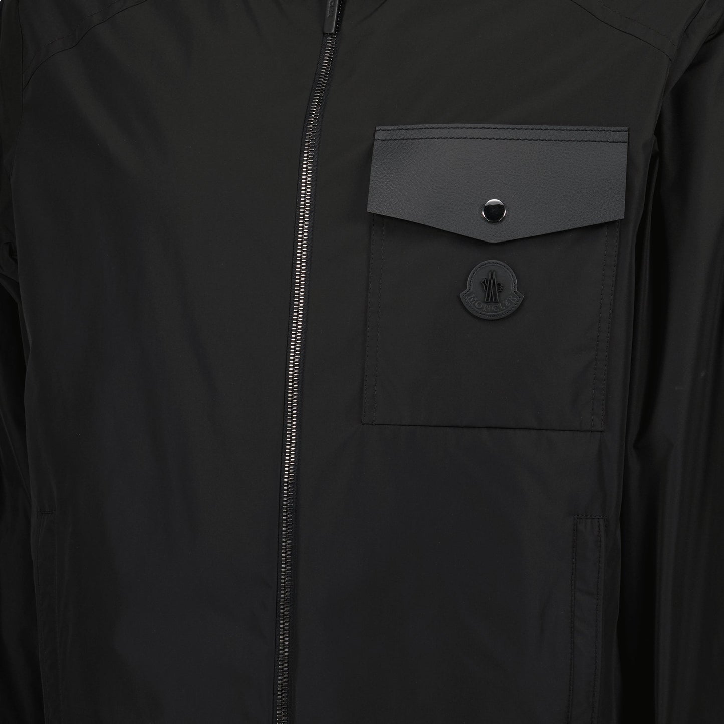 black windbreaker, adjustable hood, leather details, autumn-winter jacket, ribbed edges