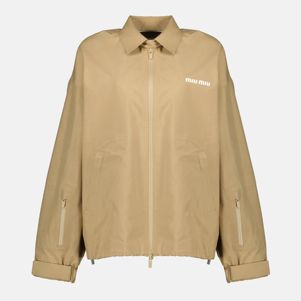 beige windbreaker, Miu Miu outerwear, spring-summer 2026 collection, technical polyester jacket, stylish windbreaker