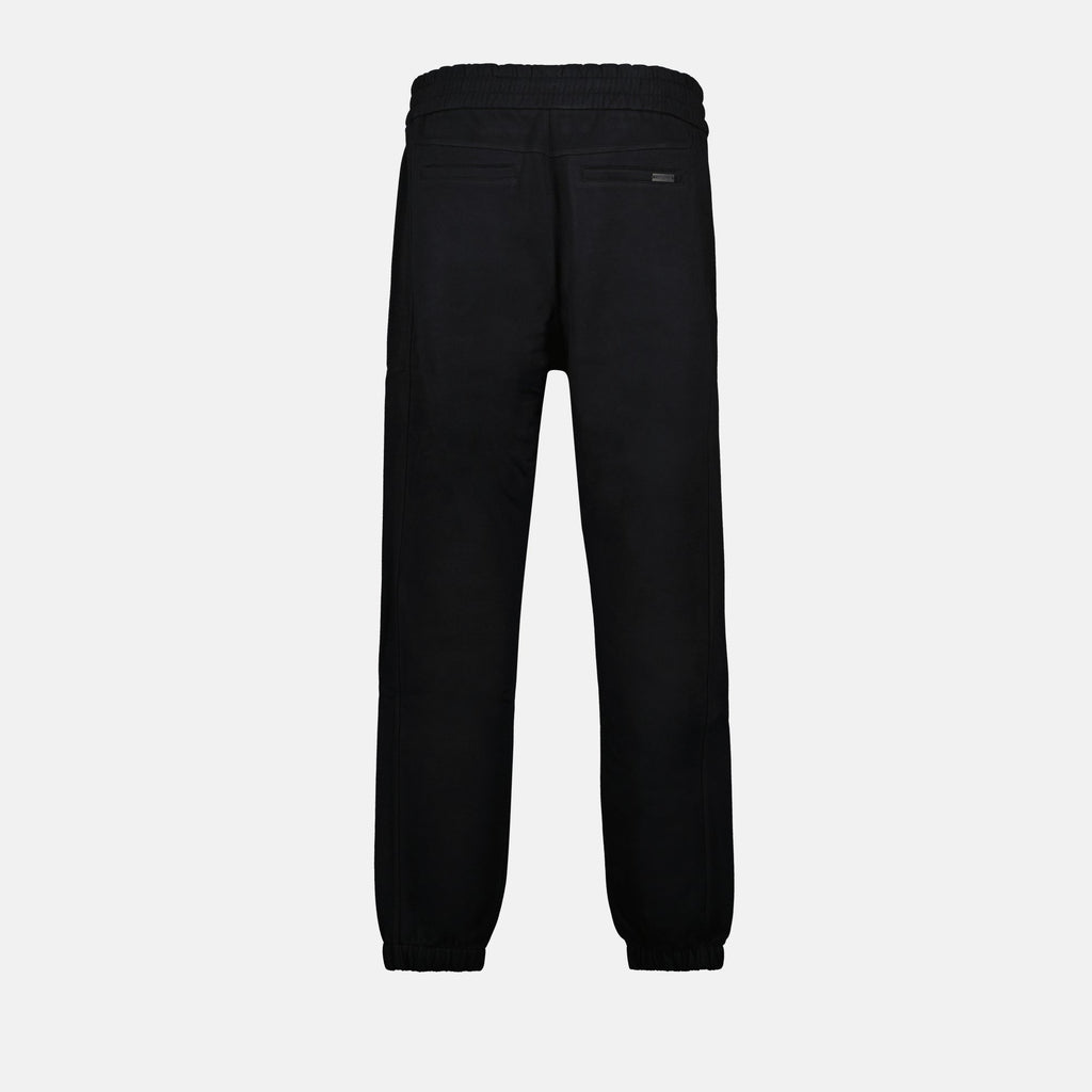 Image of Black Cotton Jogger Pants by Saint Laurent for Men - Season Autumn-Winter 2024 - Back View
