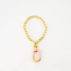 pink resin necklace, T-bar closure necklace, modern jewelry, Spring-Summer 2025 collection, engraved logo accessories