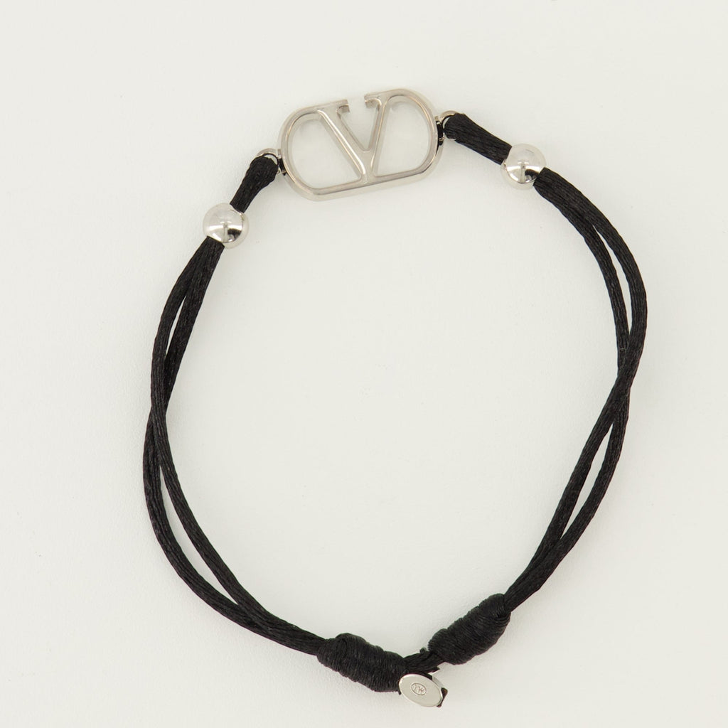 Image of Vlogo Bracelet with Black Cord by Valentino Garavani for Men - Season Spring-Summer 2026 - Detail View 1