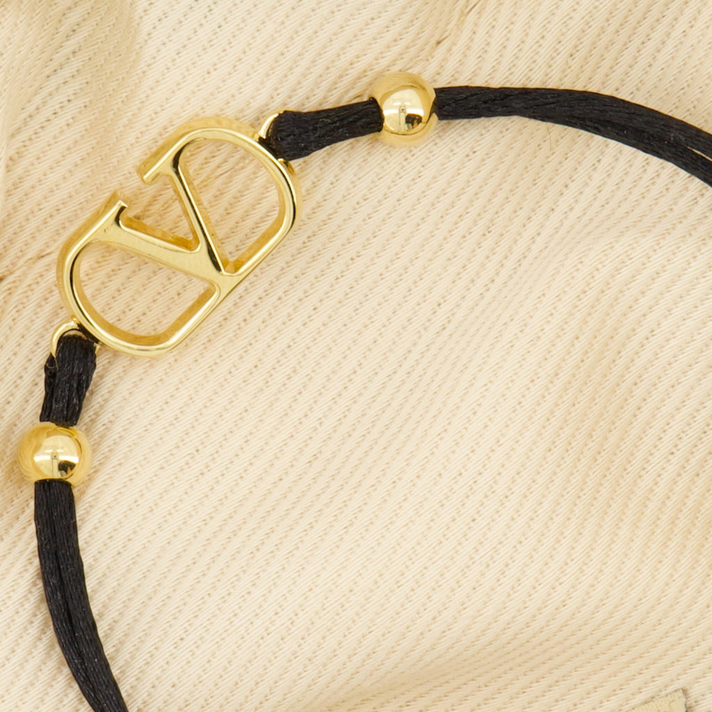 Valentino Garavani bracelet, VLogo signature accessory, cotton bracelet, gold finish jewelry, luxury fashion bracelet