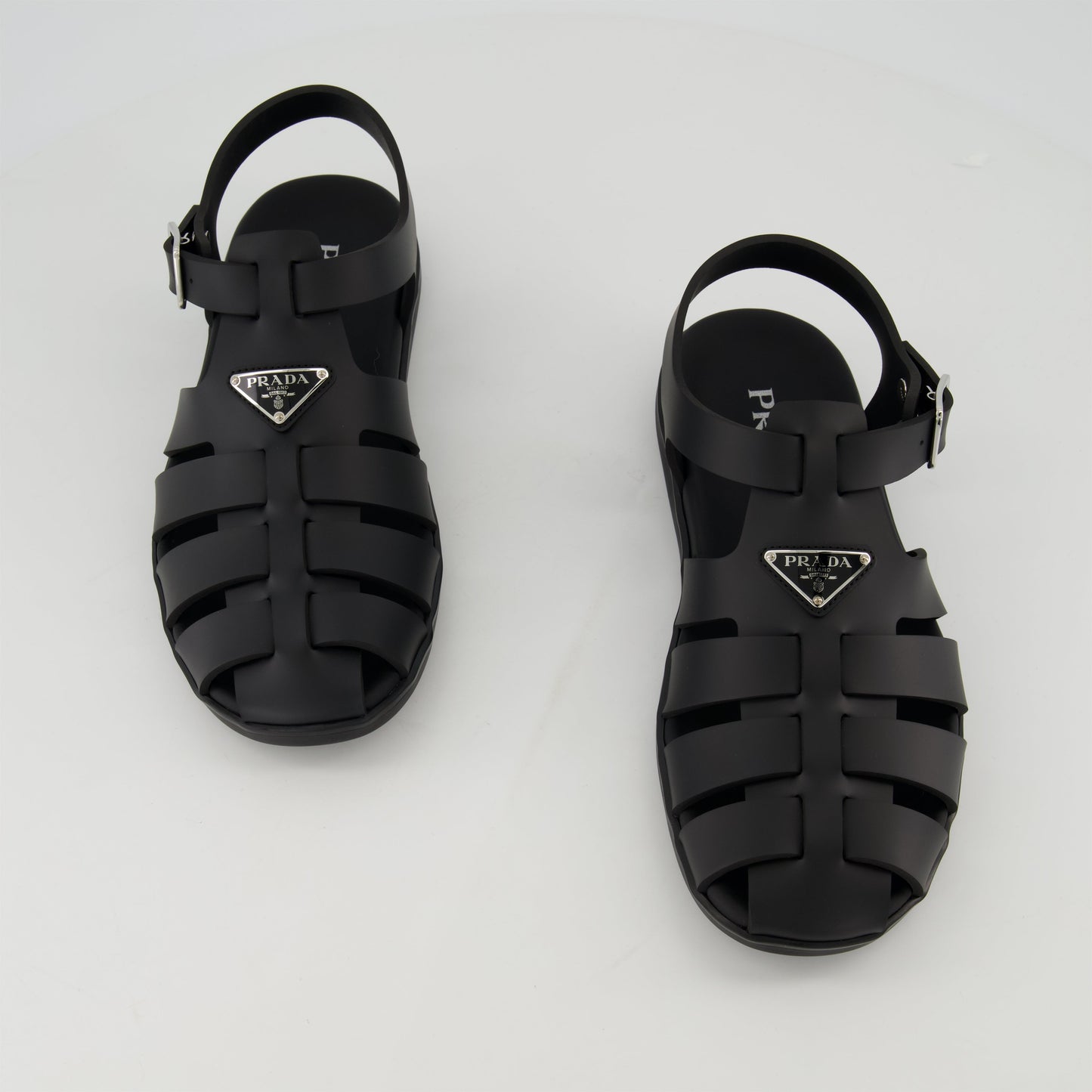 fisherman sandals, black rubber sandals, Prada footwear, adjustable sandals, casual footwear