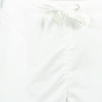 Moncler women's shorts, luxury nylon shorts, white designer shorts, high-end casual wear, elegant women’s shorts