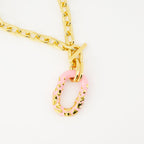 pink resin necklace, T-bar closure necklace, modern jewelry, Spring-Summer 2025 collection, engraved logo accessories