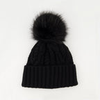 Immagine di un berretto in cashmere con pompon nero di Moncler per donne - Stagione Autunno-Inverno 2025 - Vista posteriore