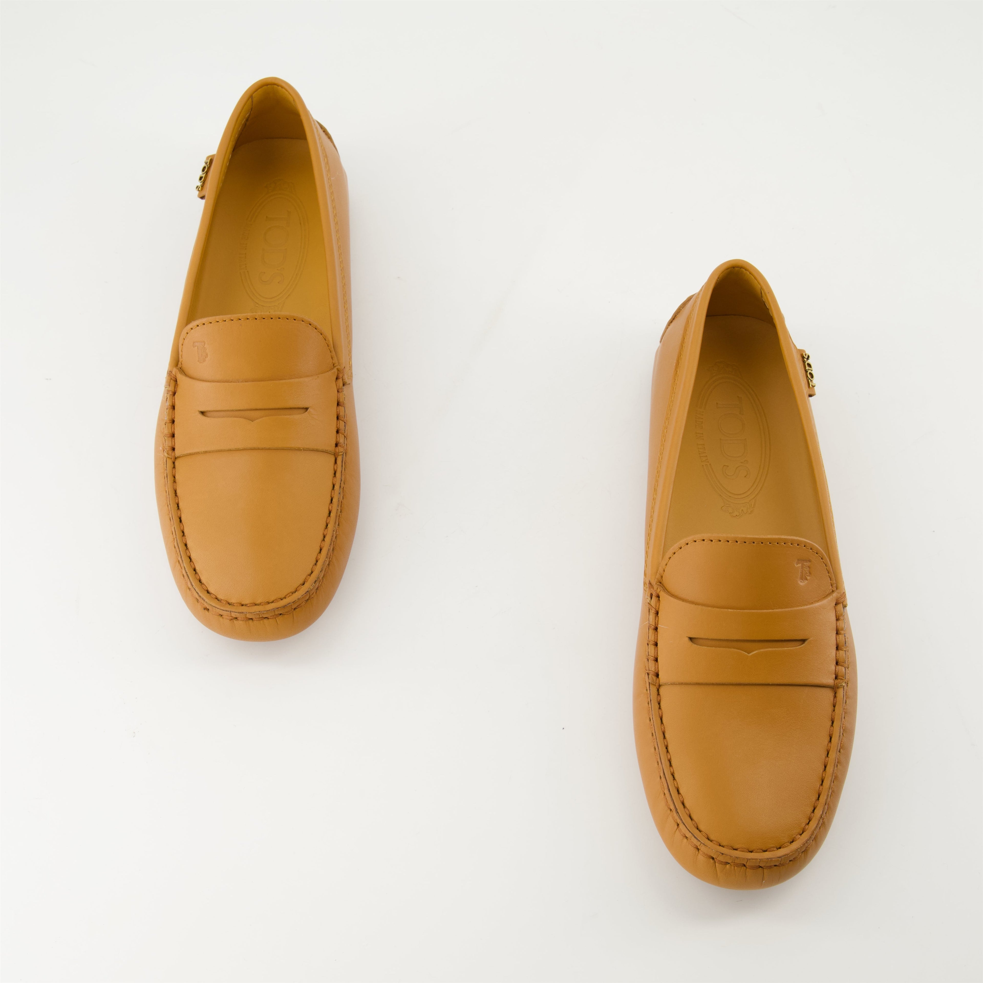 Tod's loafers, Gommino loafers, leather footwear, luxury loafers, brown leather shoes