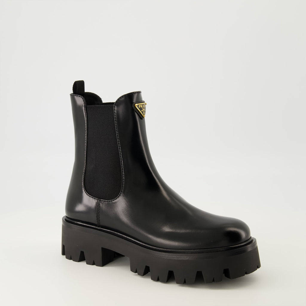 Prada ankle boots, black leather boots, Autumn-Winter 2025, slip-on design, rubber tread sole