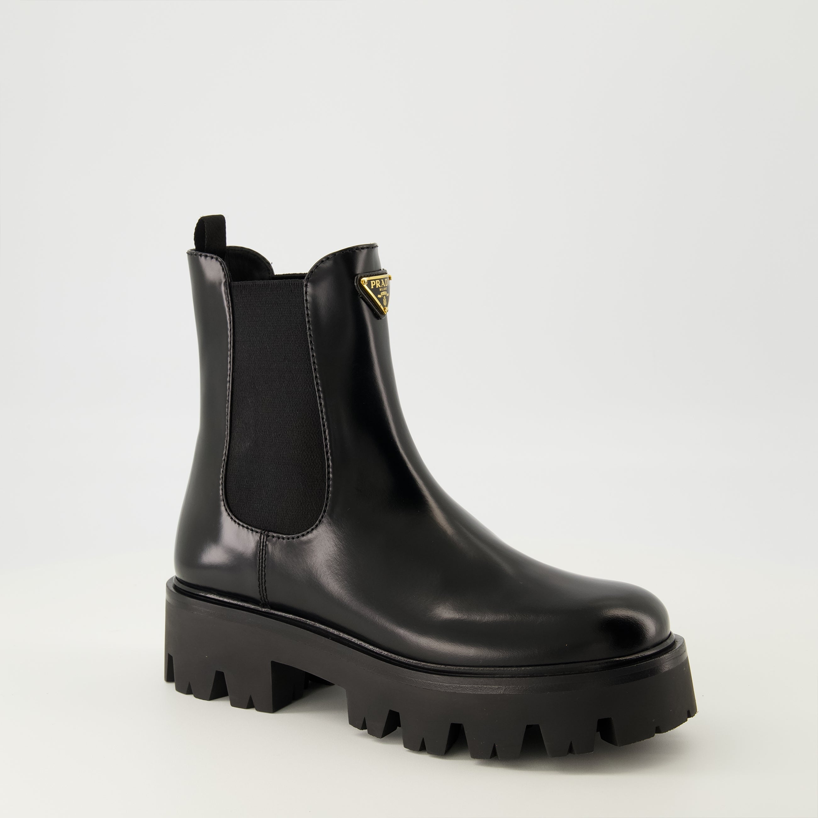 Prada ankle boots, black leather boots, Autumn-Winter 2025, slip-on design, rubber tread sole