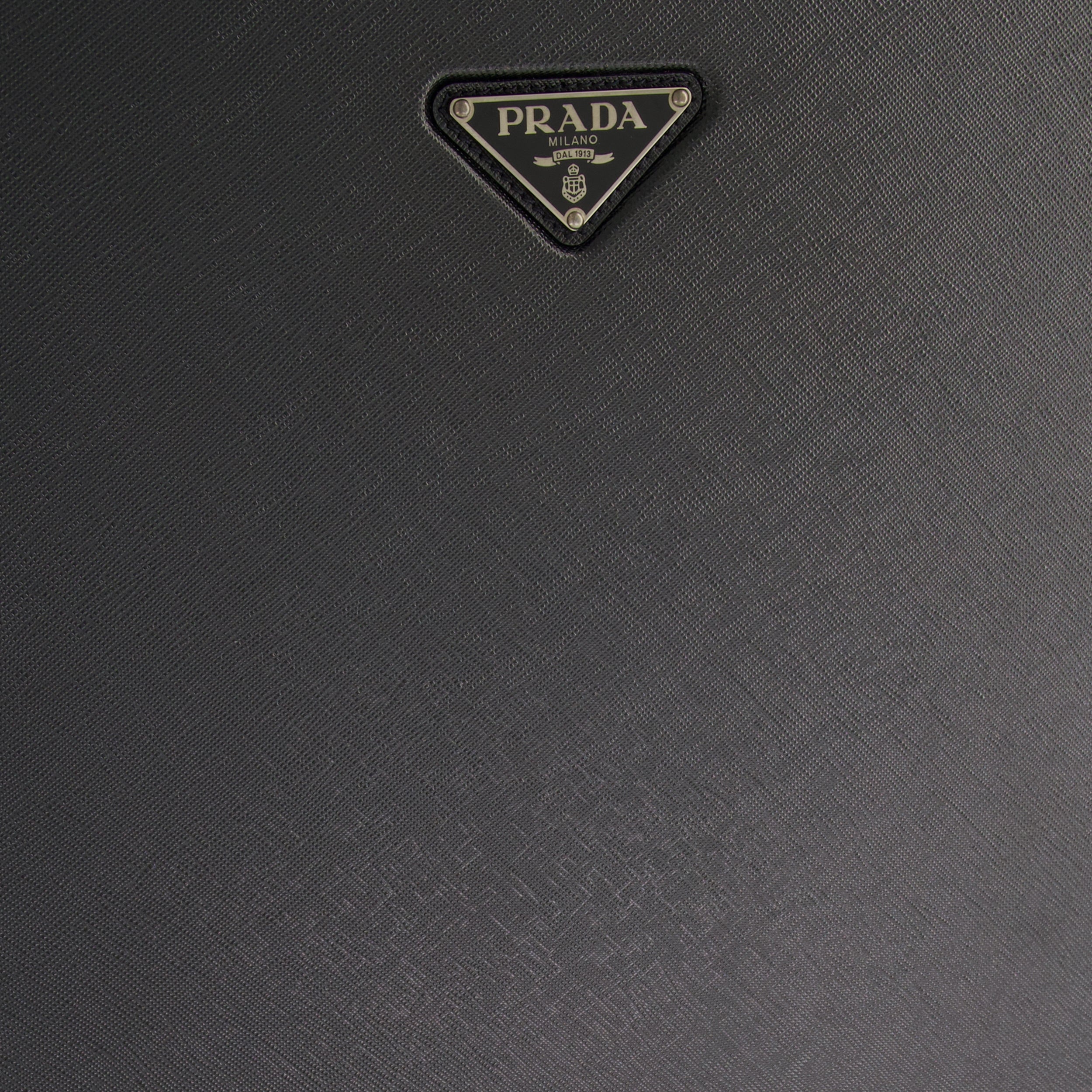 leather rolling luggage, Prada, travel accessories, cabin luggage, luxury travel bag