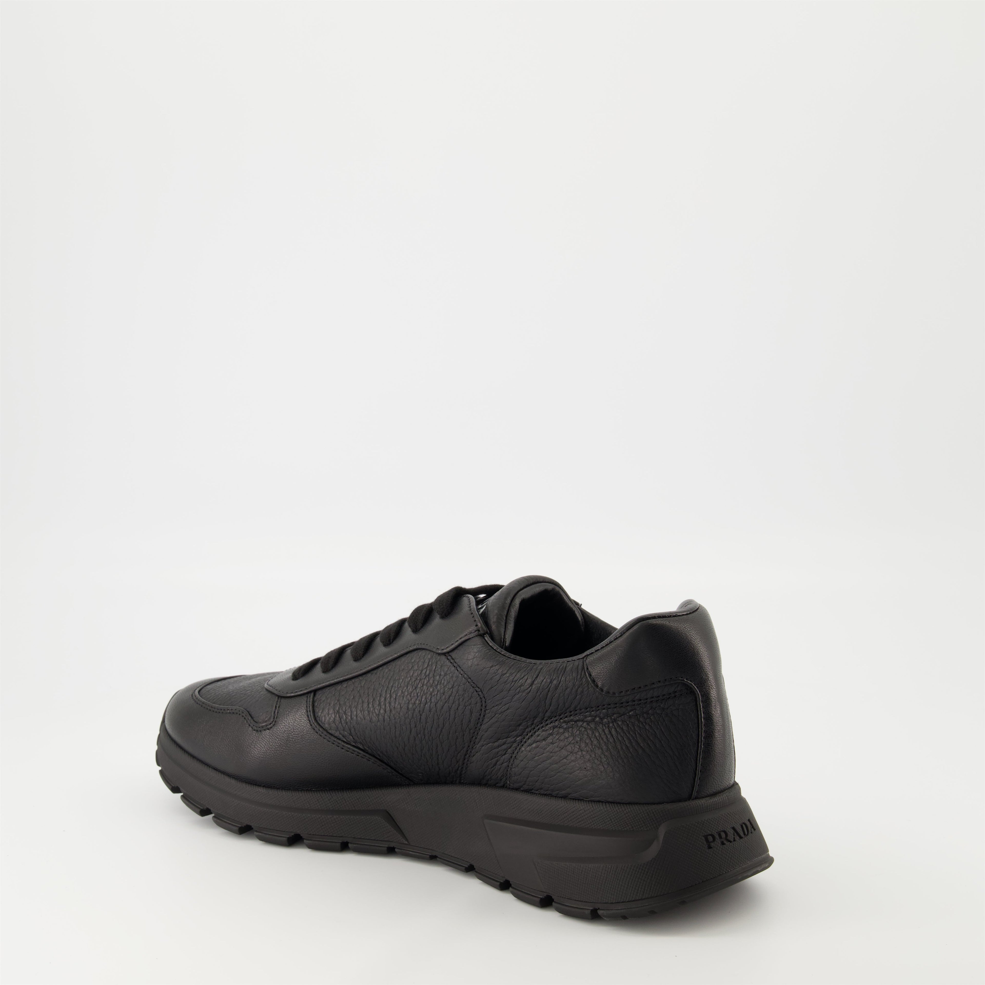 Prada sneakers, black leather sneakers, Prax 01 model, men's footwear, luxury menswear