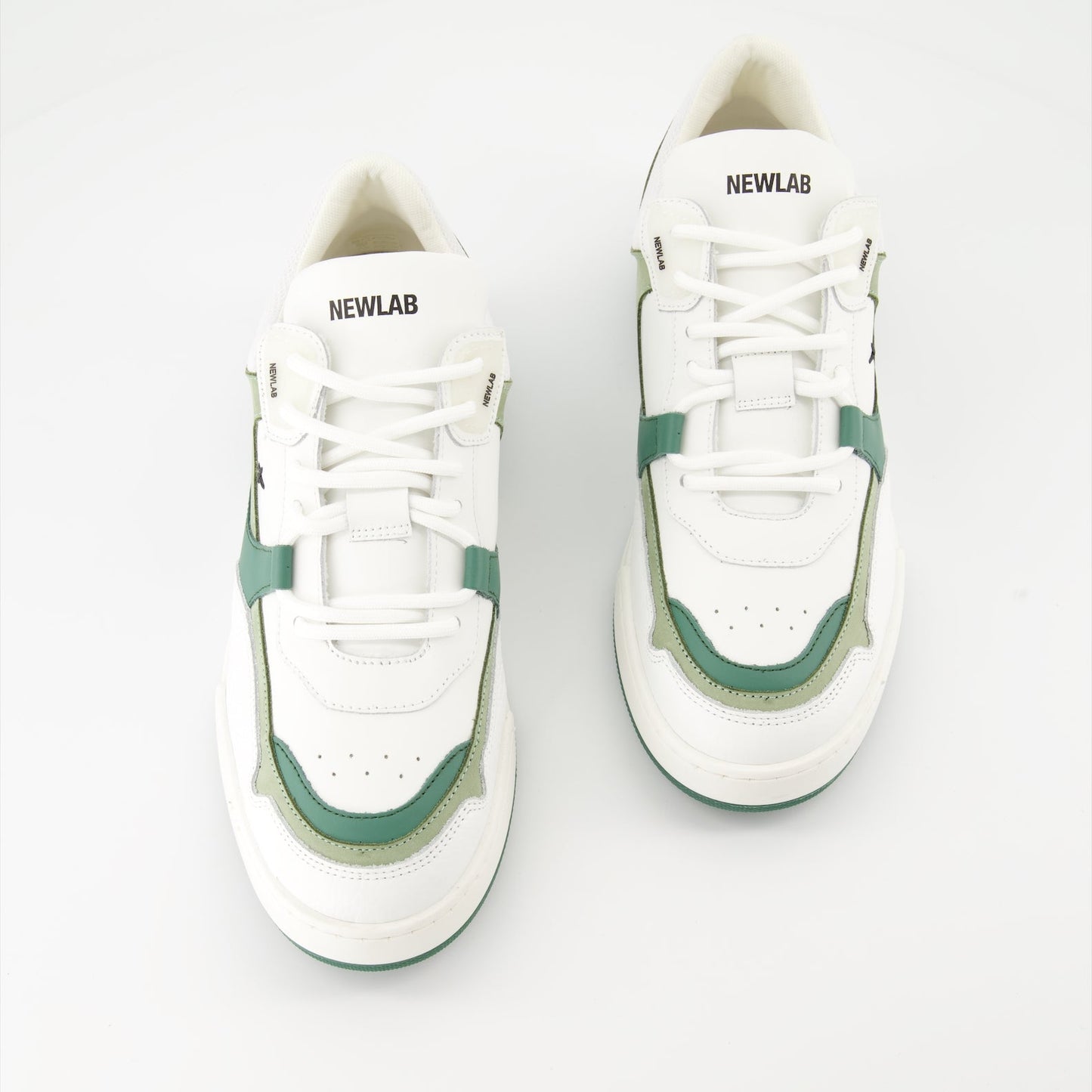 luxury sneakers, white leather shoes, green suede accents, New Lab collection, high-end fashion