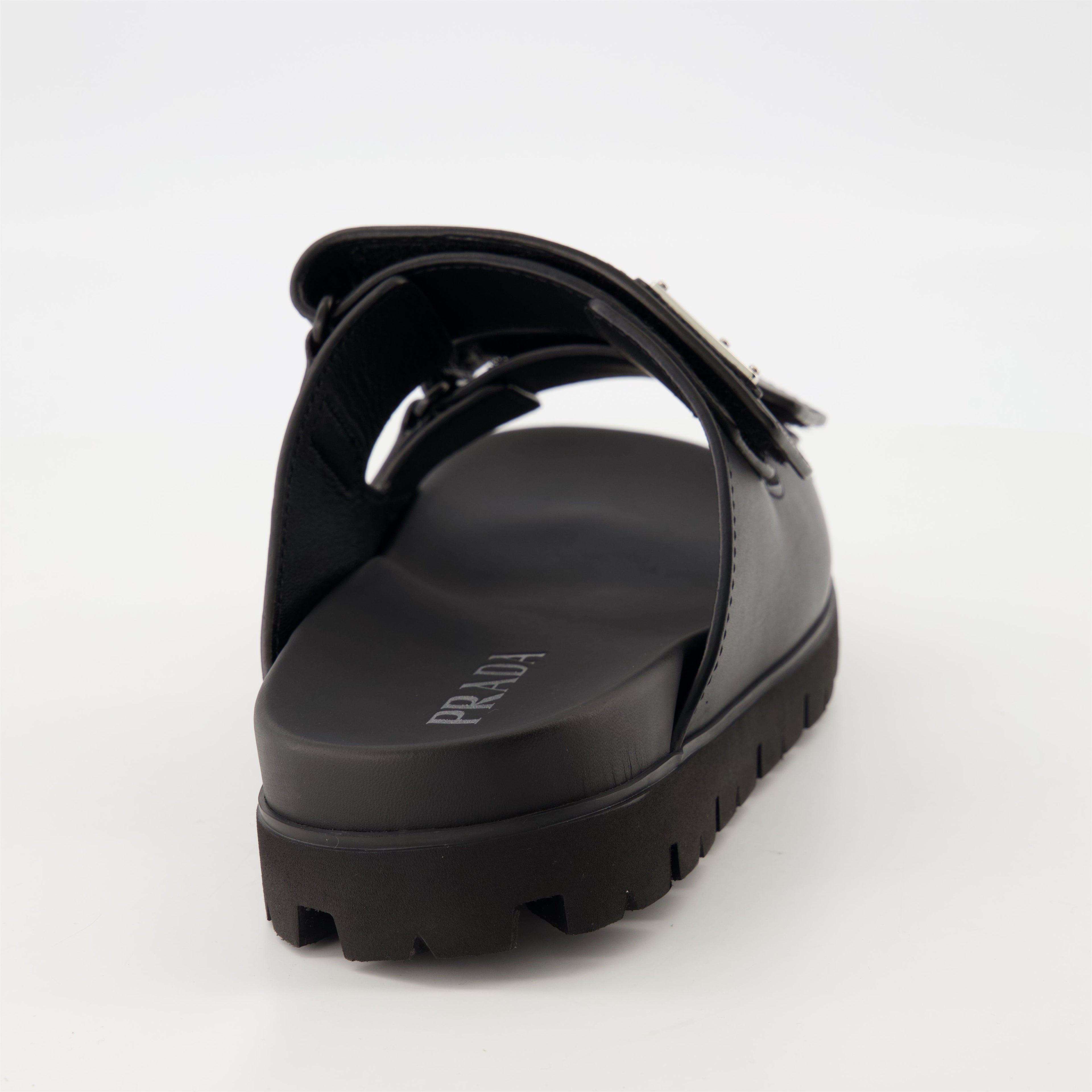 black leather slides, Prada slides, men's leather footwear, stylish casual shoes, comfortable leather sandals