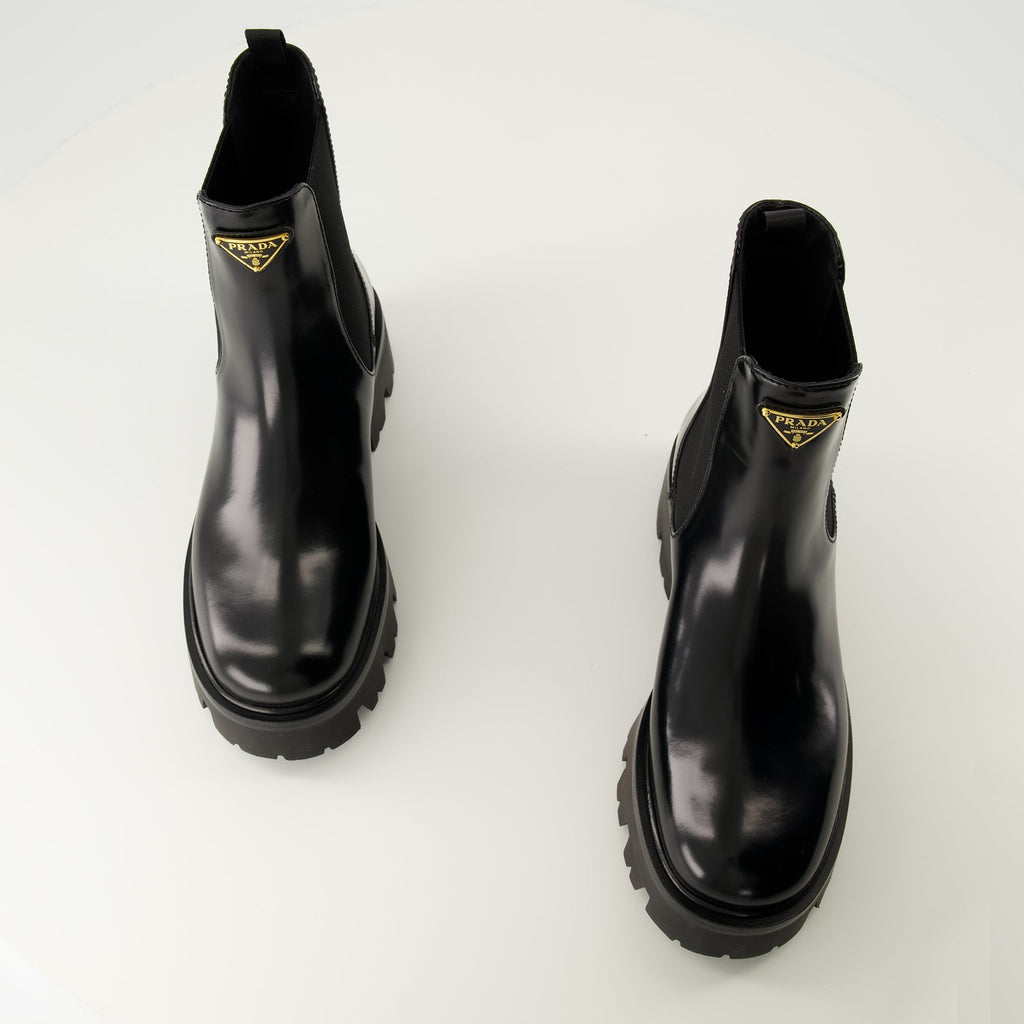 Prada ankle boots, black leather boots, Autumn-Winter 2025, slip-on design, rubber tread sole