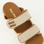 Image of Miu Miu Beige Canvas Mules by Miu Miu for Women - Season Spring-Summer 2026 - Top Detail View