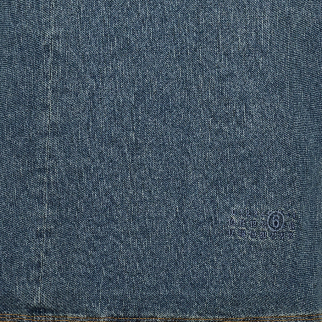 denim vest, V-neck design, sleeveless clothing, embroidered logo, light blue denim