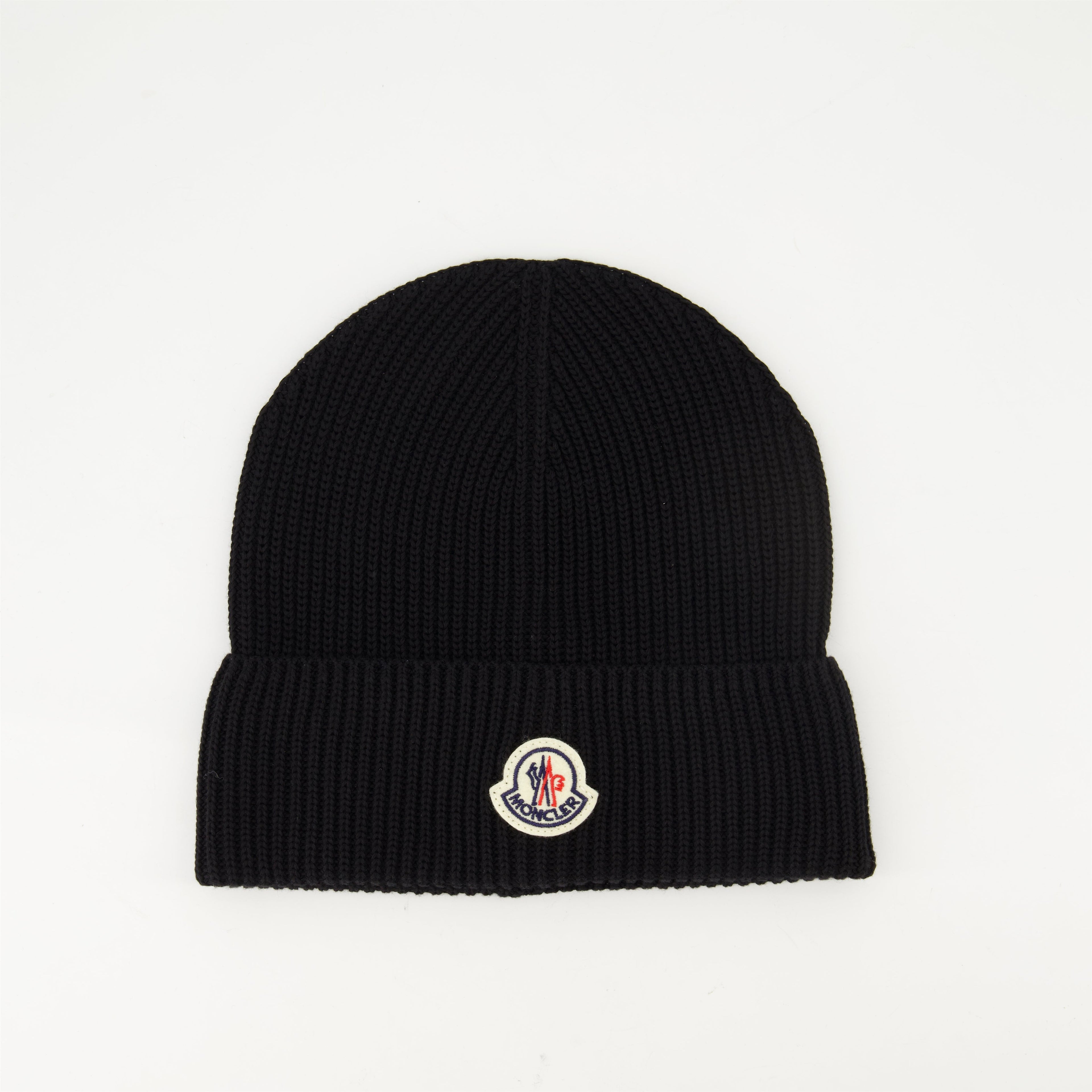 black knit bonnet, Moncler logo, Spring-Summer 2025, ribbed cotton accessory, stylish headwear
