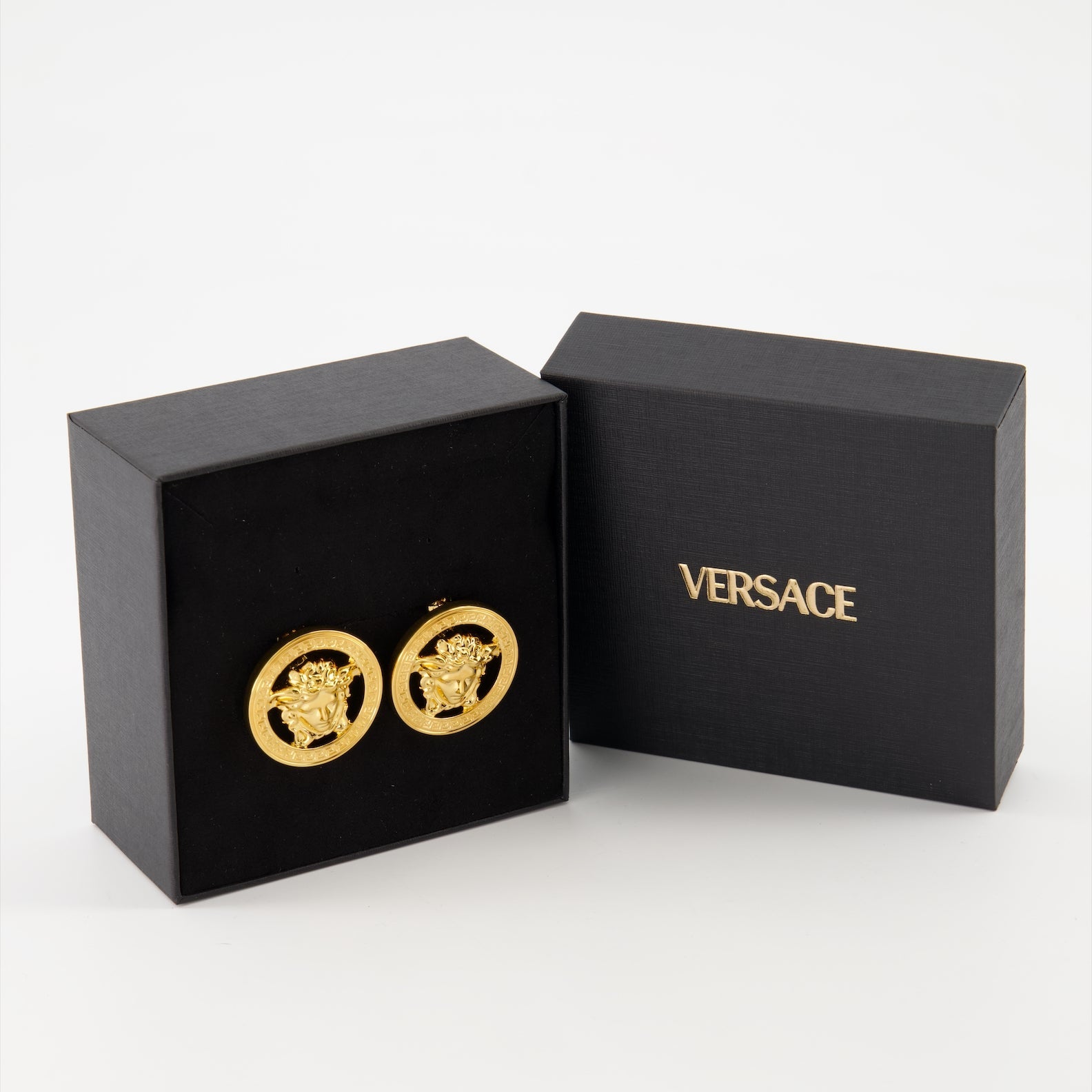 Versace earrings, gold metal earrings, luxury jewelry, designer accessories, Medusa earrings