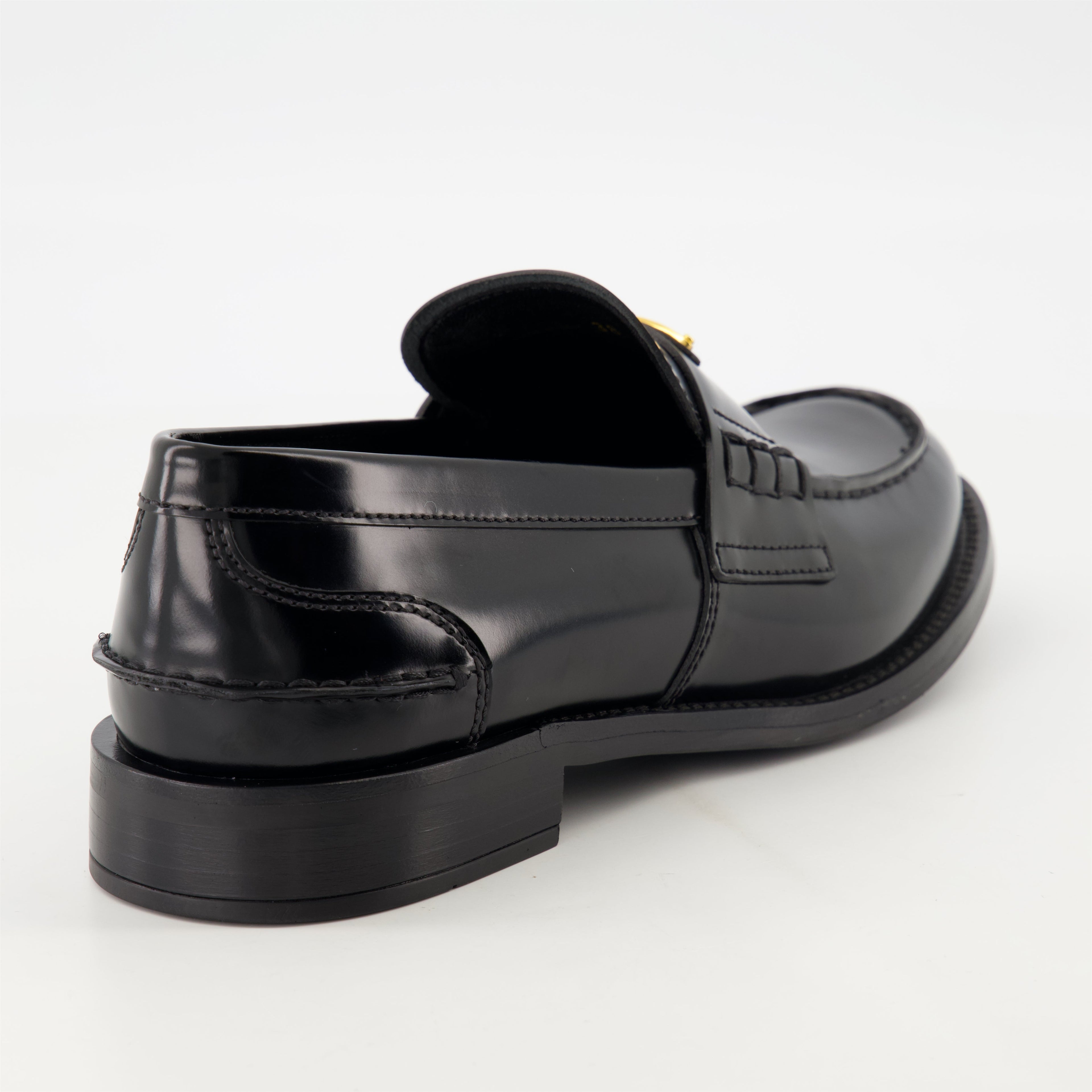 black leather moccasins, Prada footwear, brushed leather shoes, designer slip-ons, stylish moccasins