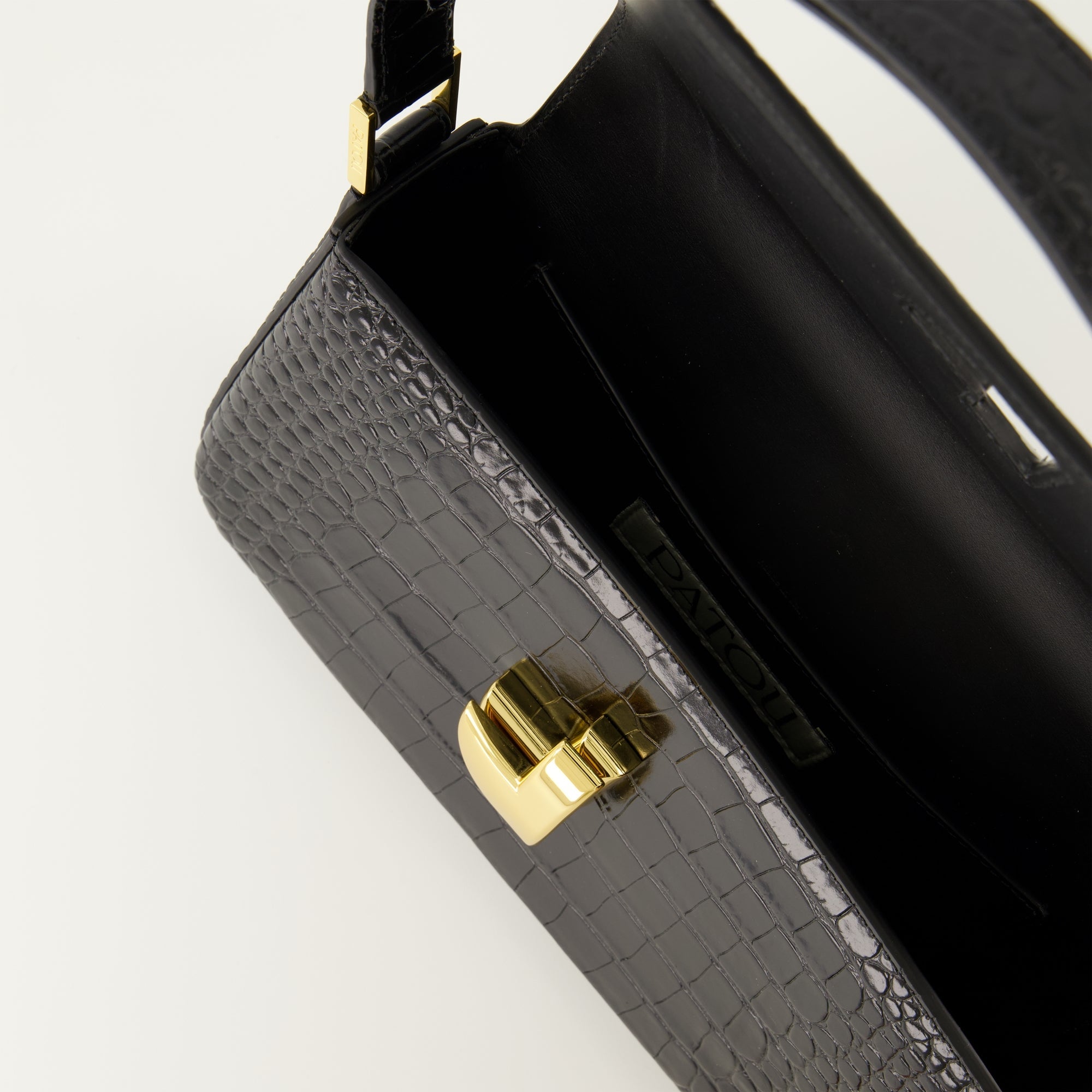 Patou handbag, croco-effect leather bag, elegant black handbag, Art Deco clasp, adjustable handle handbag