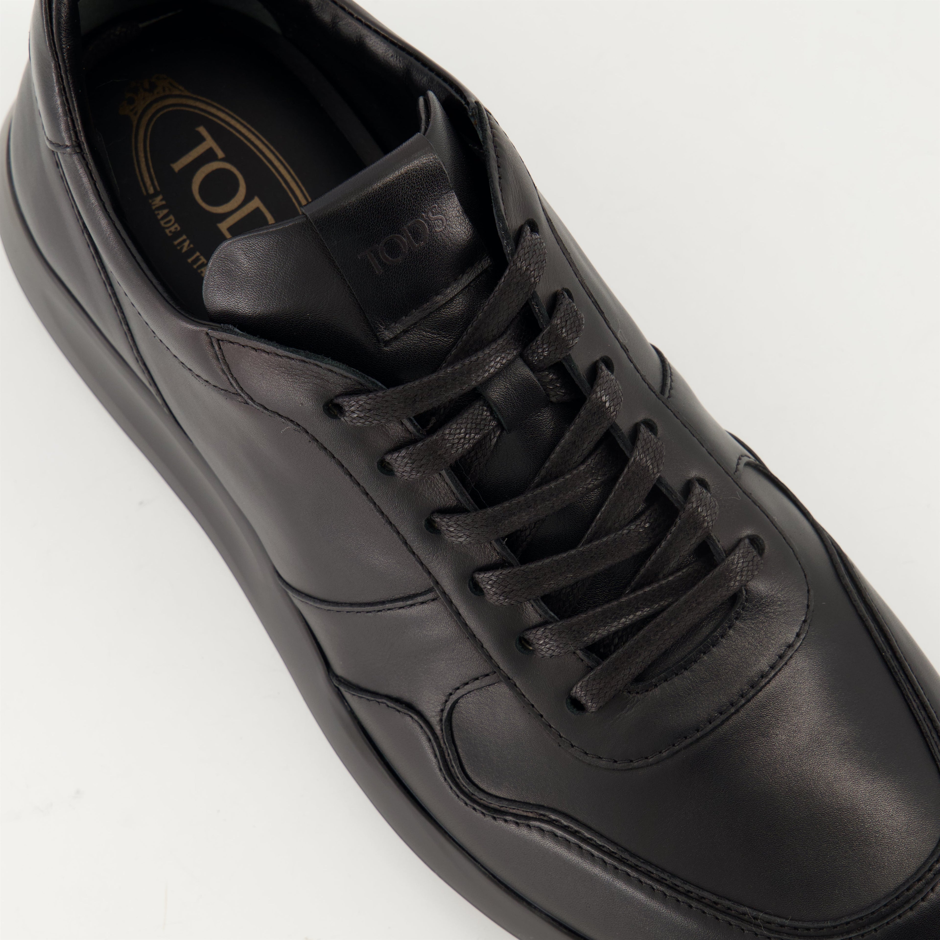 black sneakers, Tod's shoes, leather footwear, stylish sneakers, casual elegance