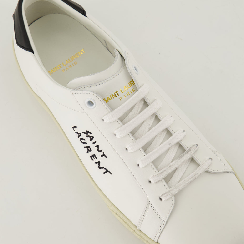 smooth leather sneakers, round toe design, gum sole sneakers, white leather sneakers, logo accent shoes