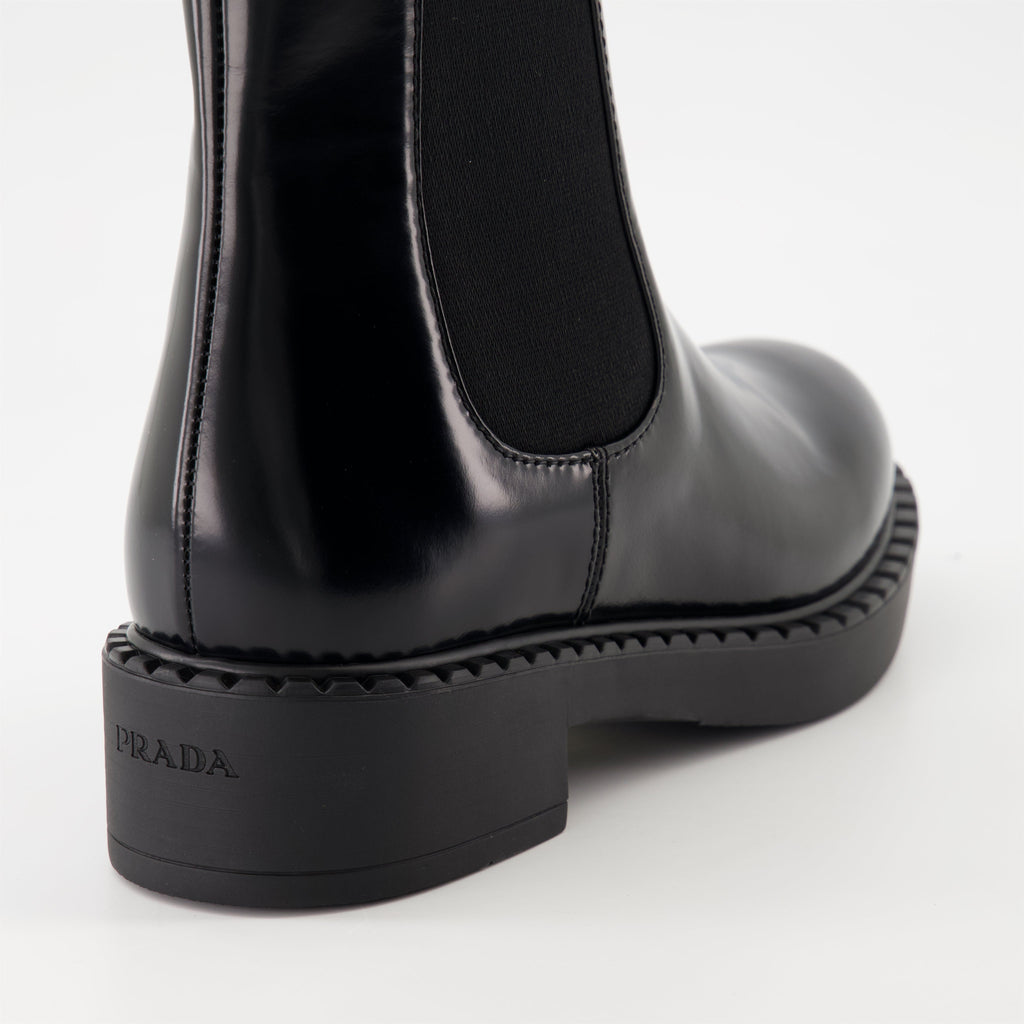   Patent leather boots, Prada ankle boots, black patent shoes, luxury footwear, autumn-winter collection.