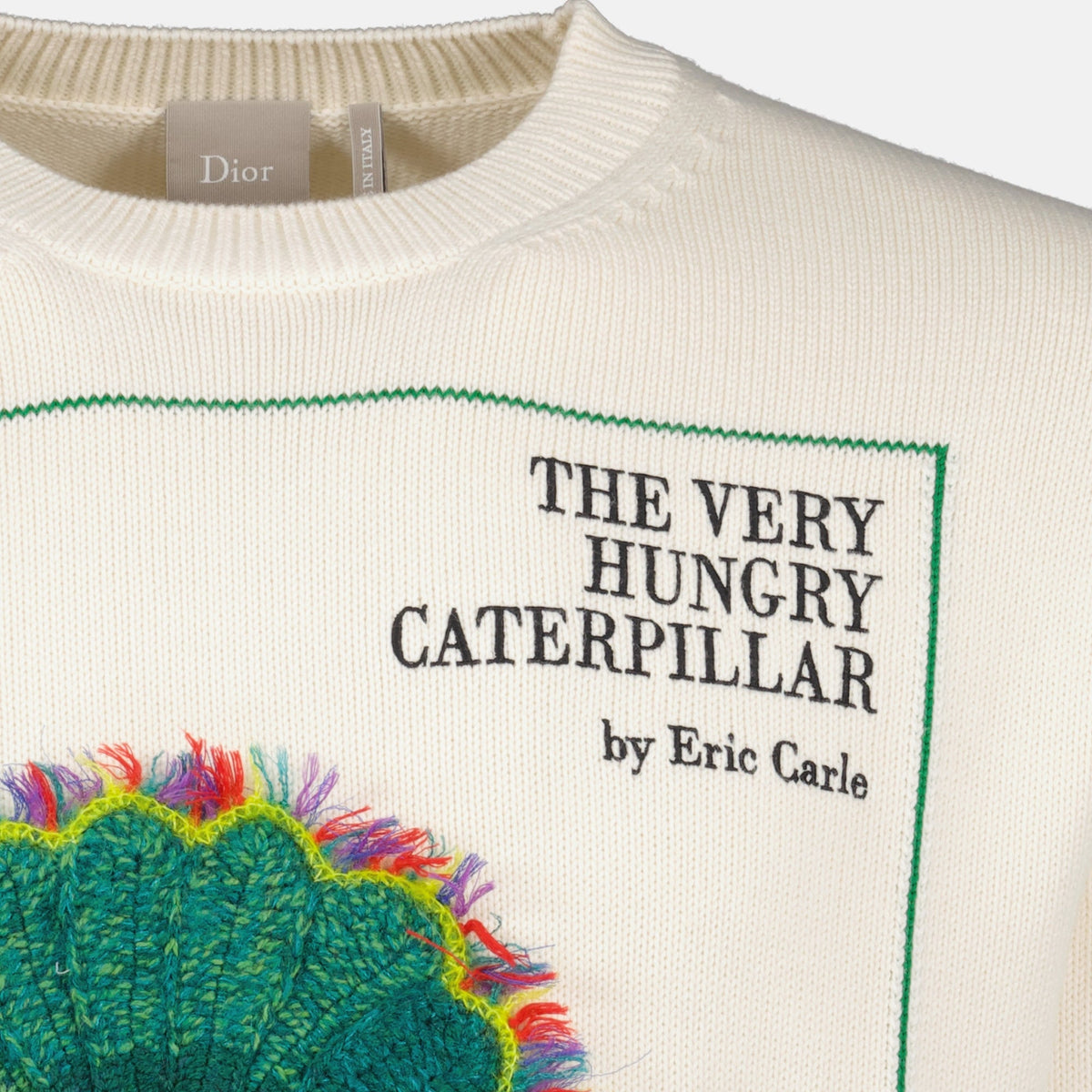 Pullover Blanc de Dior con copertina di libro