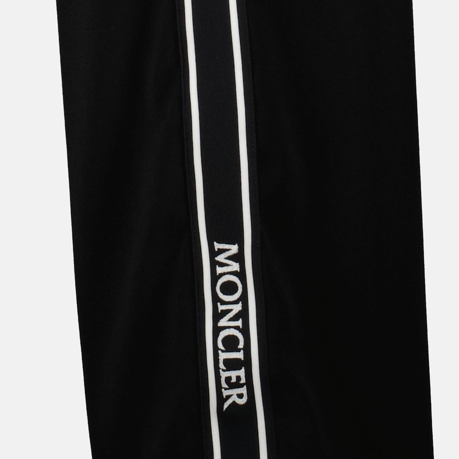 1. Black satin track pants
2. Straight-leg trousers
3. Moncler track pants
4. Branded side stripes
5. Fall winter fashion