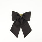 Prada barrette, Re-Nylon accessory, bow hair clip, sustainable fashion, black hair accessory