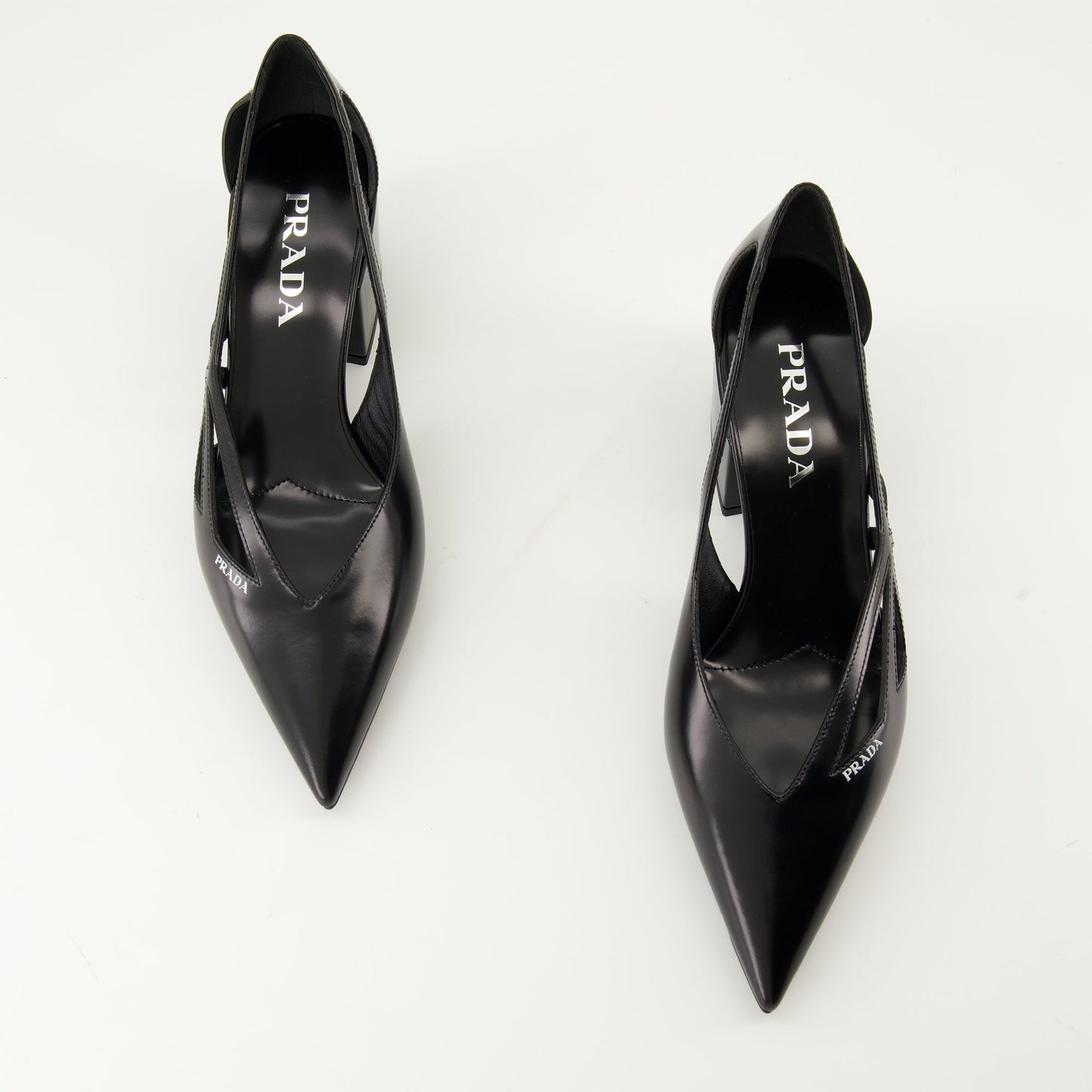 black leather pumps, pointed toe shoes, Prada pumps, cut-out pumps, luxury footwear