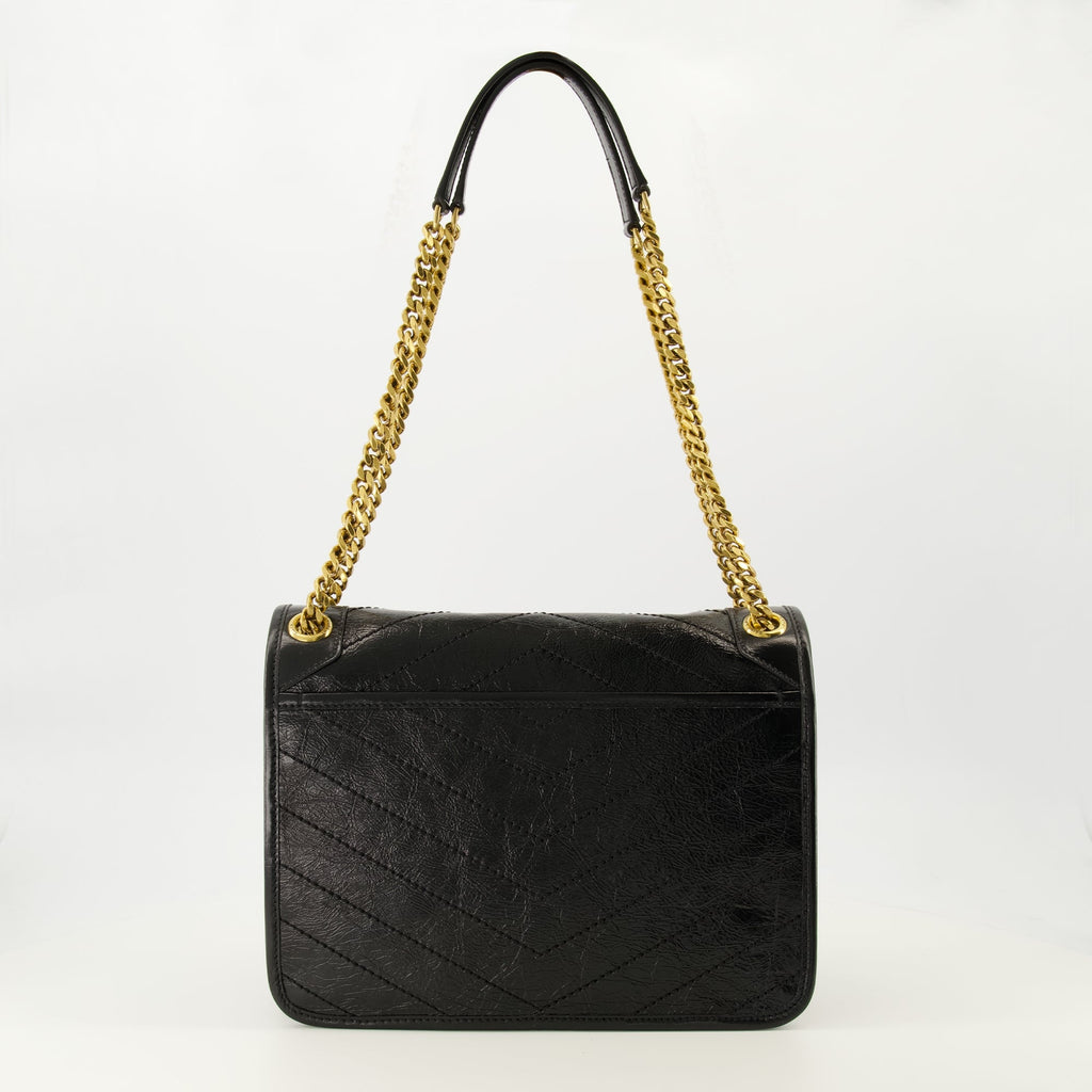 サン・ローランの女性用ニキ・ブラックバッグの画像 - シーズン春夏2026 - 後面ビュー