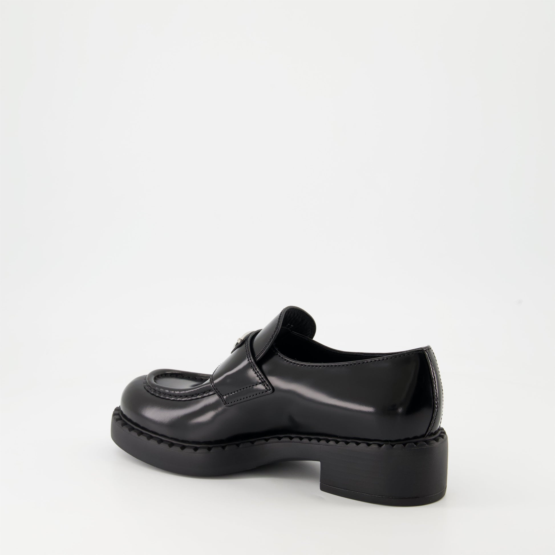 patent leather mocassins, luxury footwear, Prada AW24, black mocassins, elegant shoes