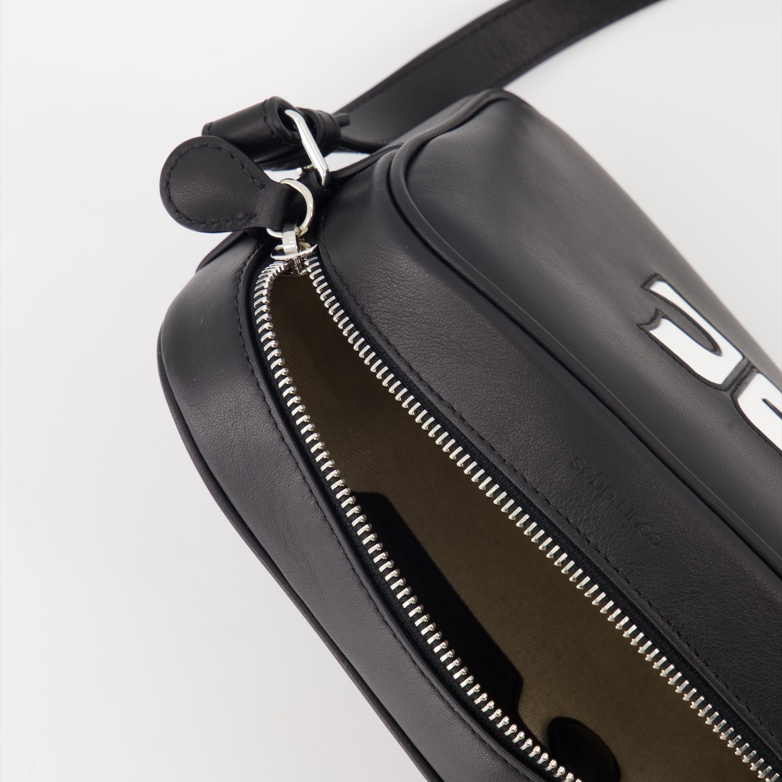 camera bag, leather bag, black accessory, Courrèges bag, adjustable strap bag