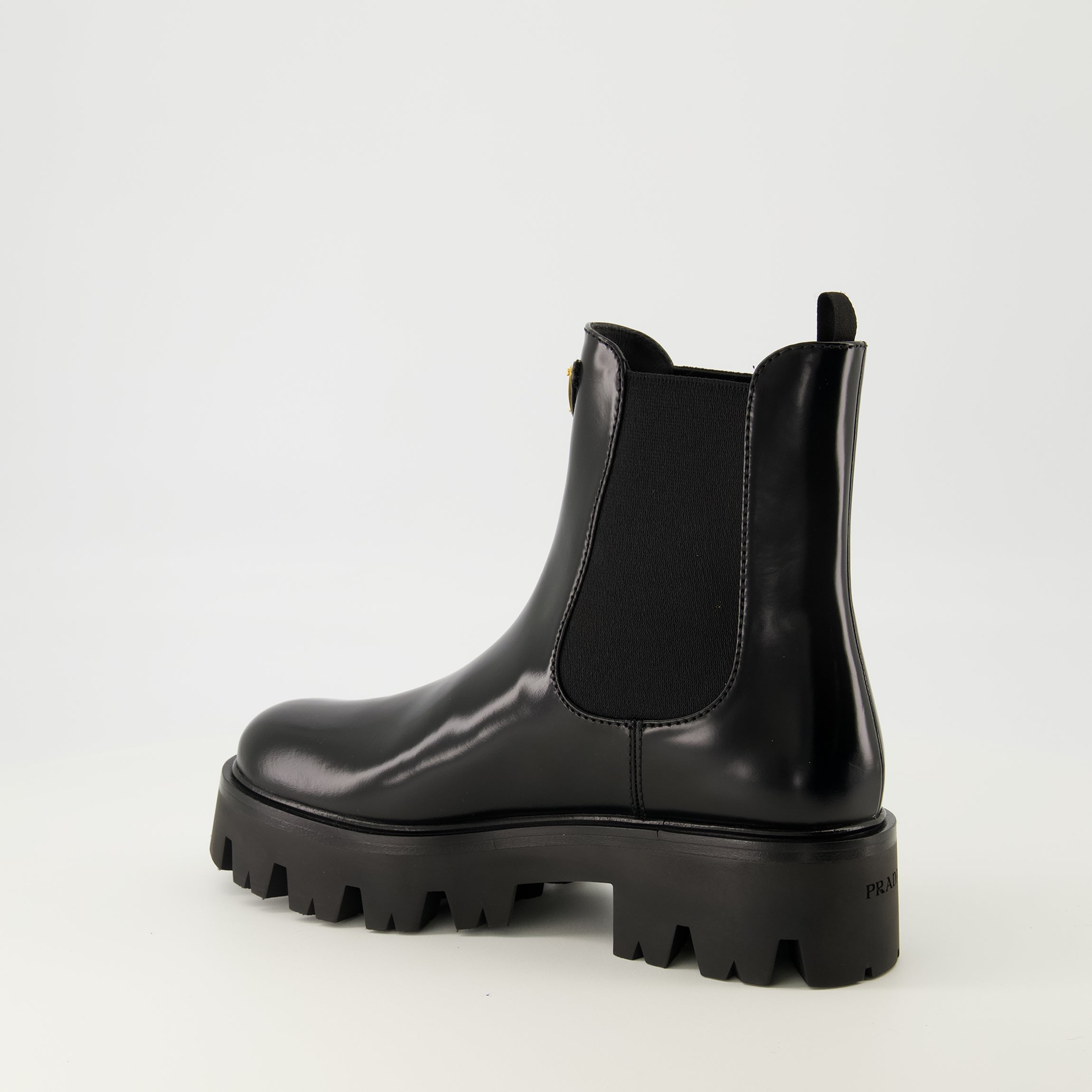 Prada ankle boots, black leather boots, Autumn-Winter 2025, slip-on design, rubber tread sole