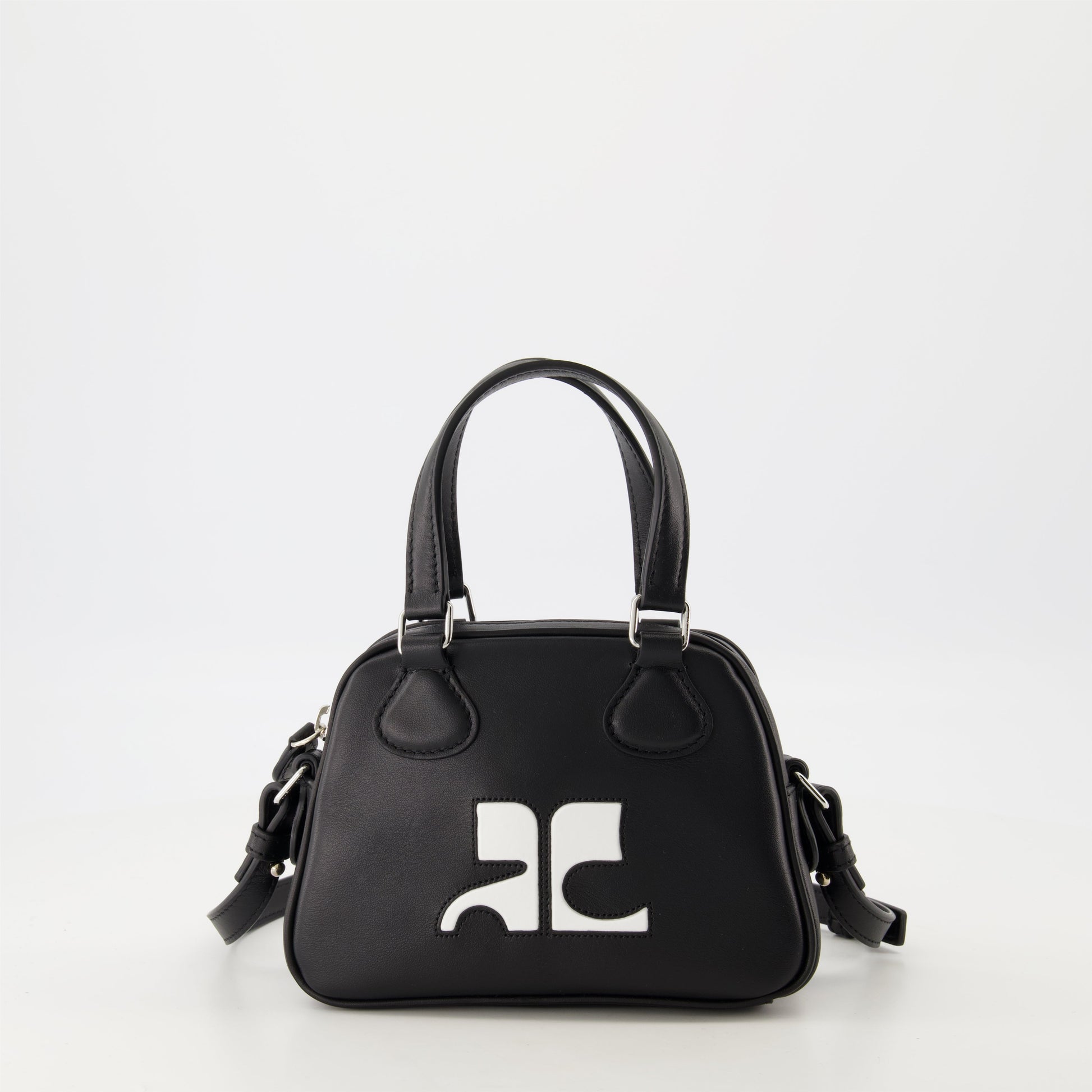 Courrèges mini bag, smooth leather bowling bag, unisex leather bag, versatile designer bag, luxury accessory