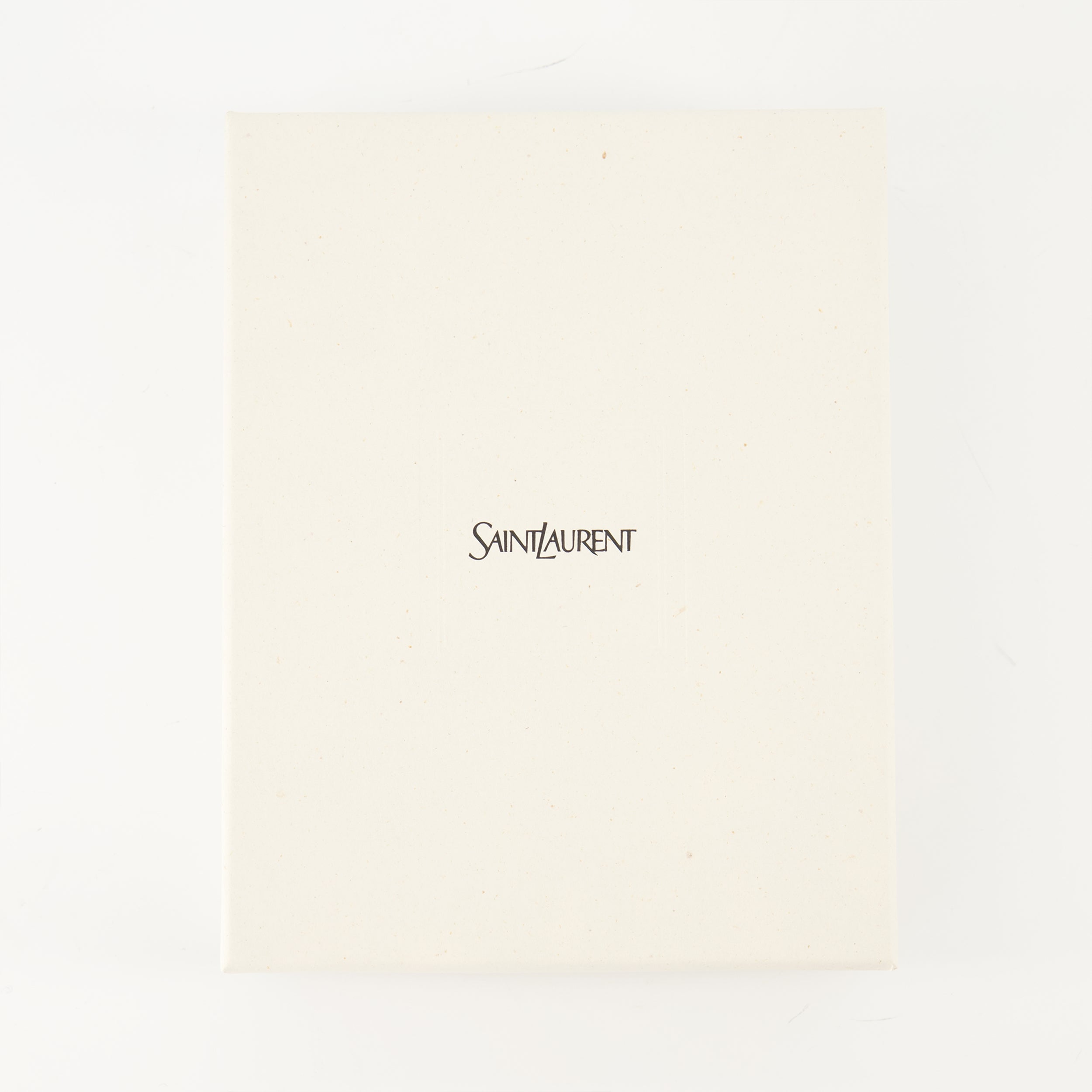 Cassandre envelope, Saint Laurent accessory, black leather bag, luxury clutch, grained leather