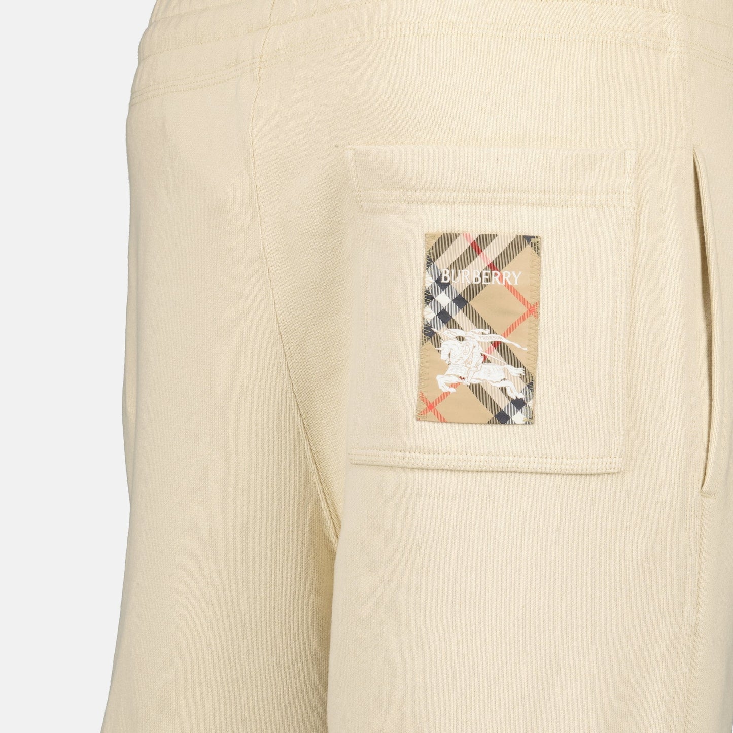 beige jogging pants, logo embroidery, wide fit pants, cotton joggers, Burberry Spring-Summer 2025