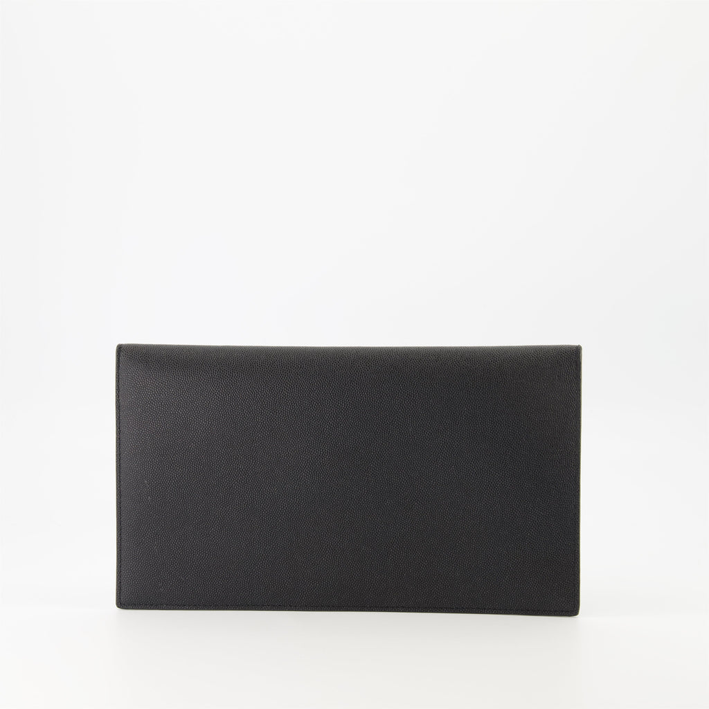 black pouch, grained leather, magnetic closure, Saint Laurent, Cassandre logo
