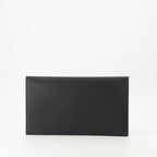 black pouch, grained leather, magnetic closure, Saint Laurent, Cassandre logo