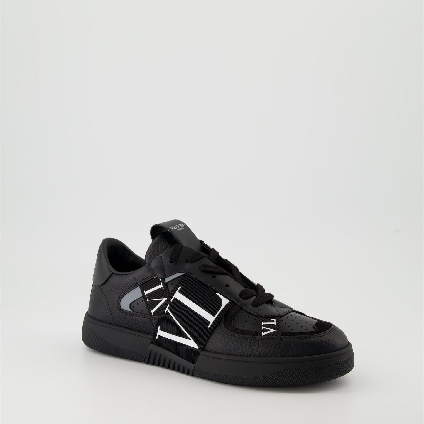 Valentino Garavani sneakers, black leather sneakers, luxury men's footwear, Autumn-Winter 2024 collection, premium grained leather