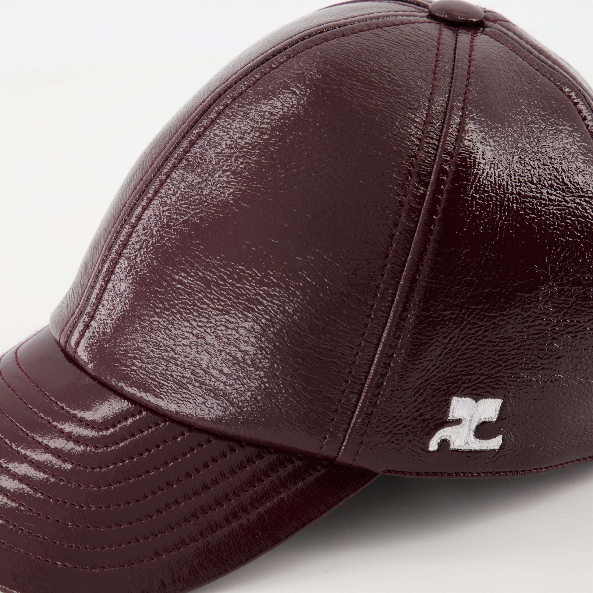 Courrèges cap, burgundy vinyl, adjustable cap, unisex fashion, embossed logo