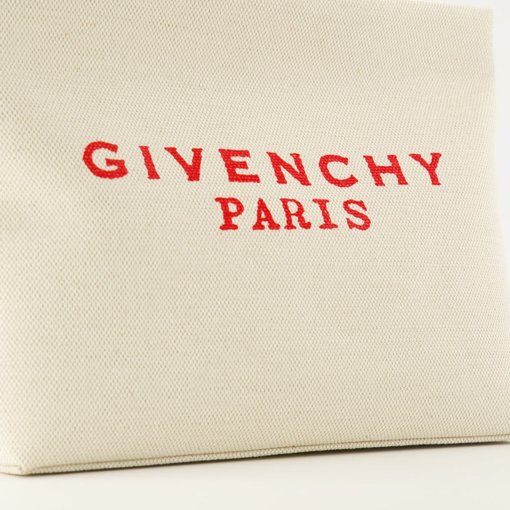 Givenchy pouch, beige canvas accessory, designer pouch, zip closure bag, fashion essentials