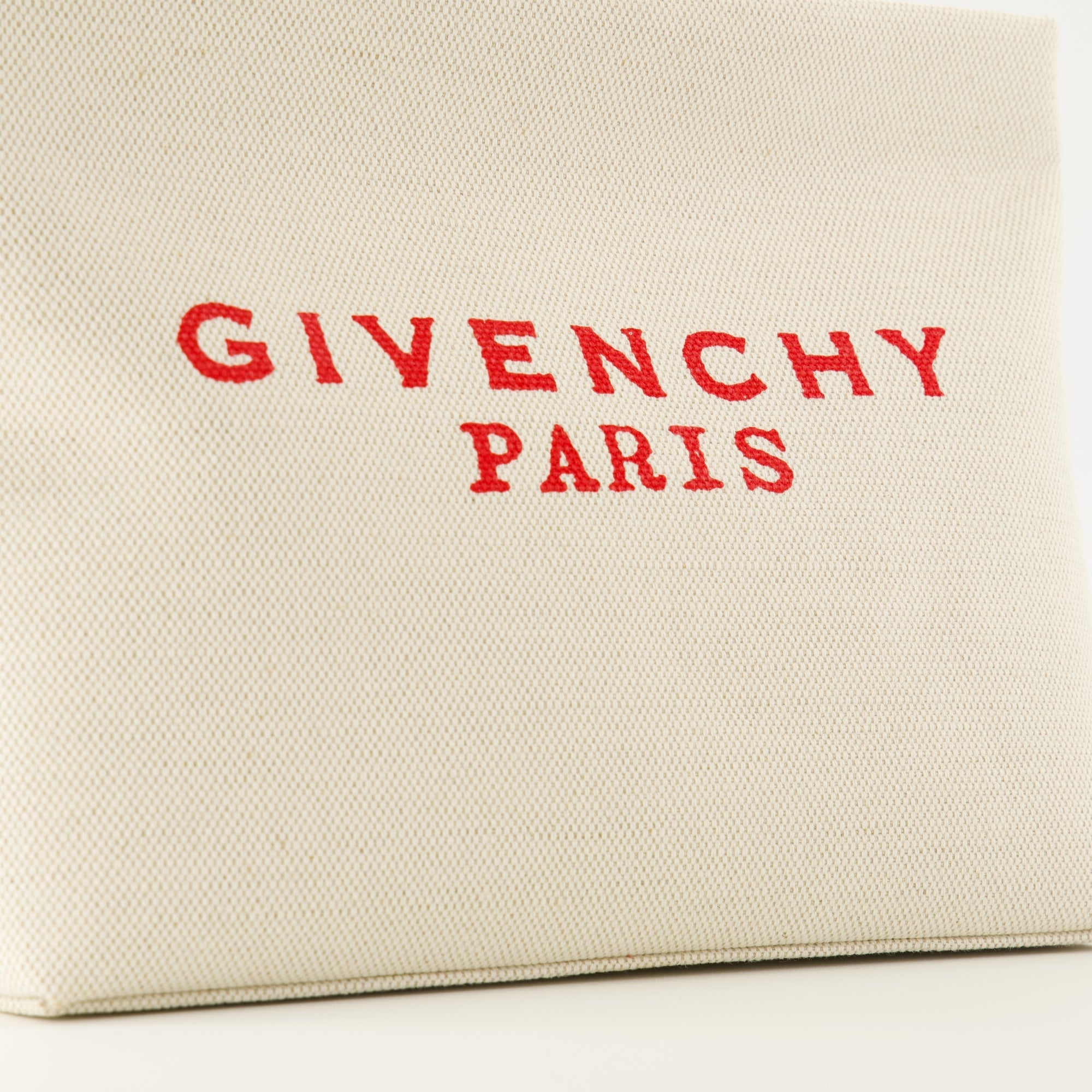 Givenchy pouch, beige canvas accessory, designer pouch, zip closure bag, fashion essentials